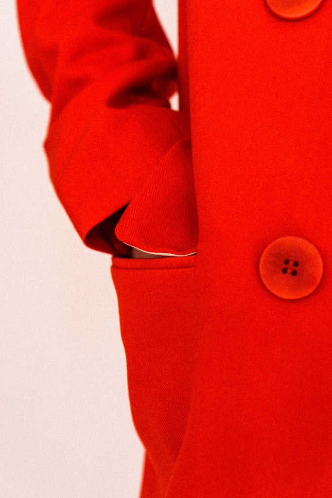 A close-up picture of the Alva Blazer pocket and buttons.